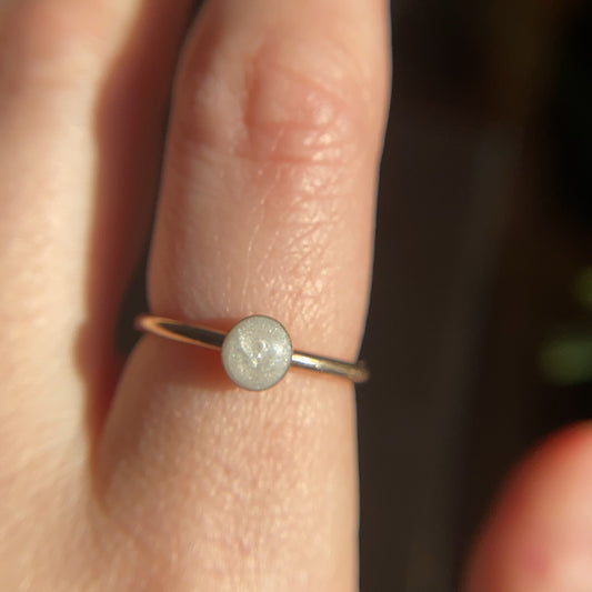 Mia Round Ring holding breastmilk or ashes, designed as a crystal-infused memorial keepsake