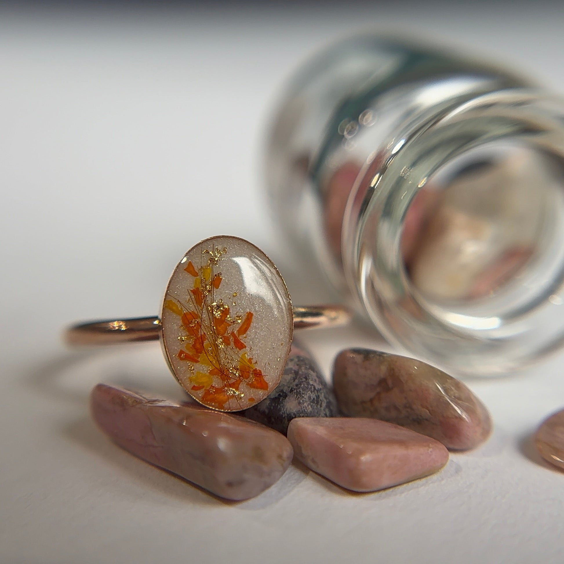 Breastmilk ring with hair and flowers in a ring