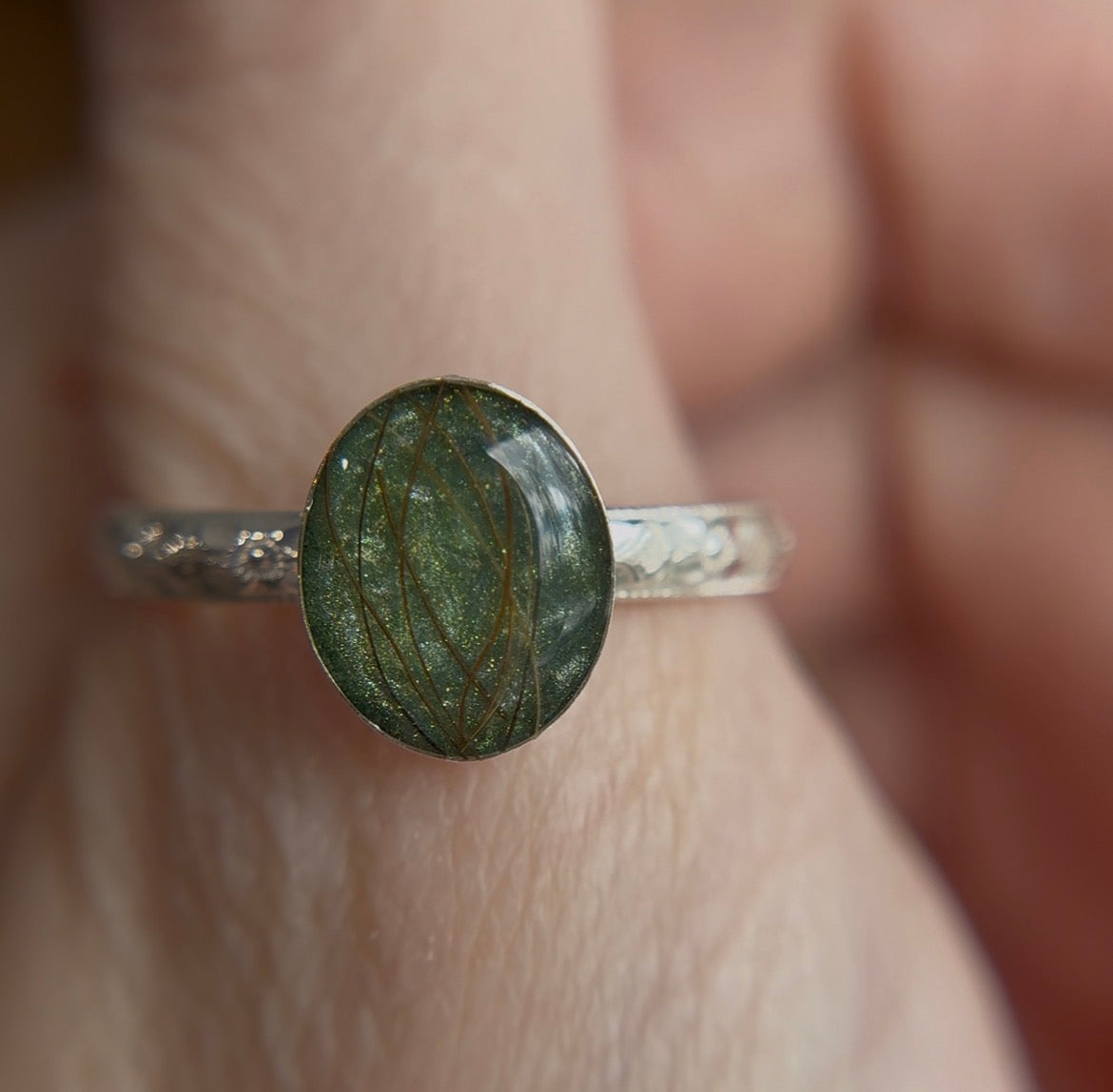 Green memorial ring with beard hair