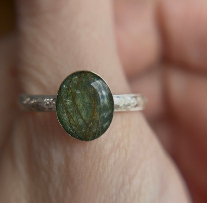 Green memorial ring with beard hair