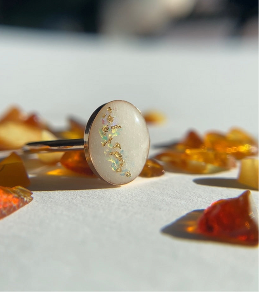 breastmilk cremation ash keepsake ring with gold flakes and opal flakes