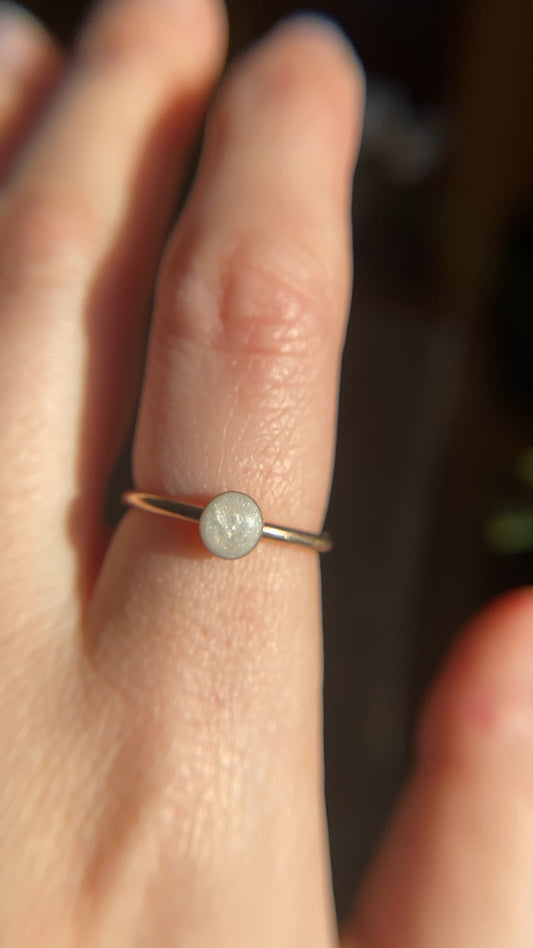 Mia Round Ring holding breastmilk or ashes, designed as a crystal-infused memorial keepsake