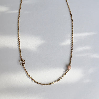 paw print and cremation ash necklace in gold